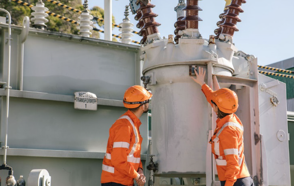 Two substation apprentices investigating an asset