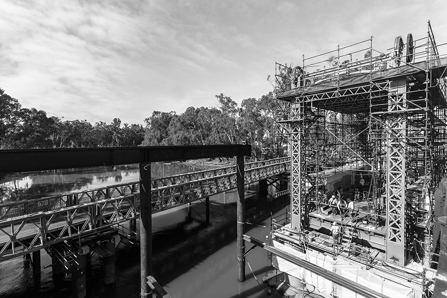 Workers prepare for the installation of the NSW truss span
