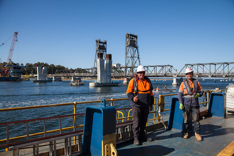 Workers on board one of the construction barges May 2020