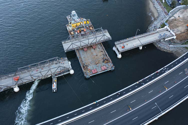 Birds eye view of span, barge and new bridge