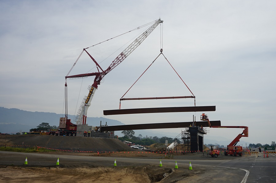 An Australian weathering steel bridge girder being lifted into place