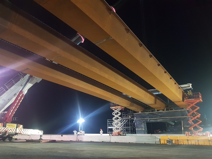 The final girder being lifted into place