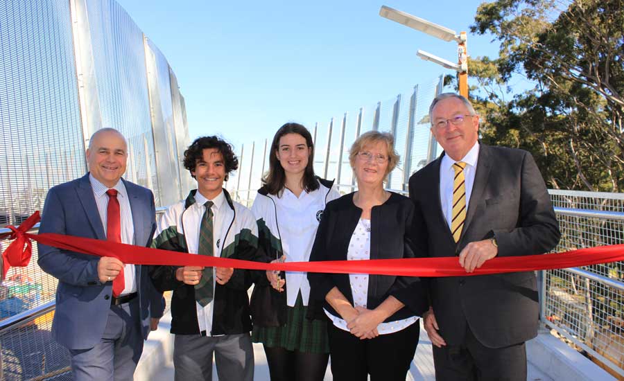 John Hardwick and local MP Brad Hazzard officially open the Hilmer Street bridge with students and s