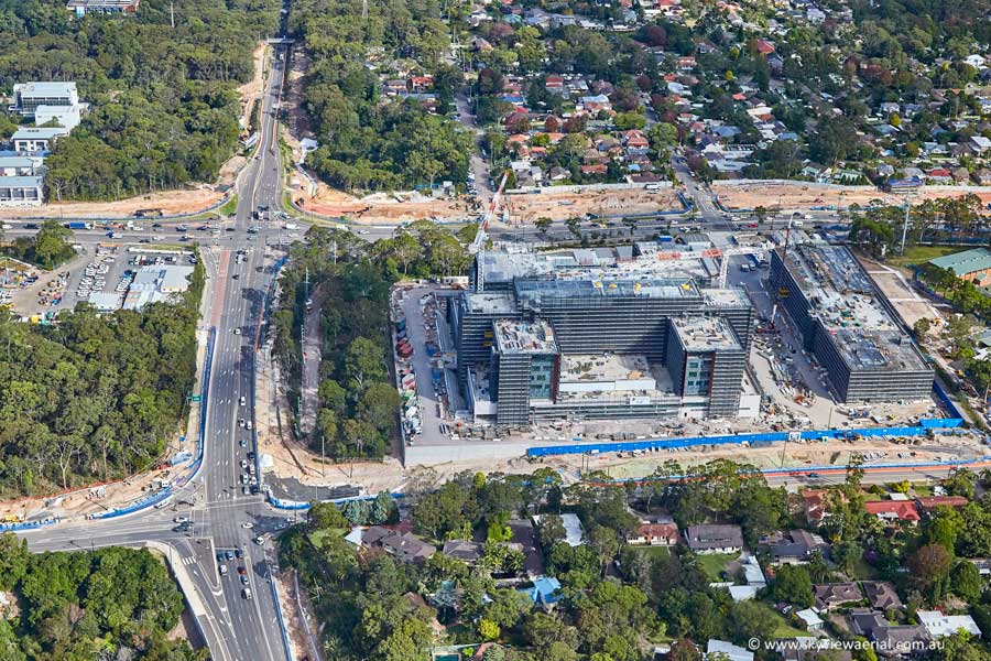 Aerial view of Northern Beaches Hospital and road network looking south towards Wakehurst Parkway - 
