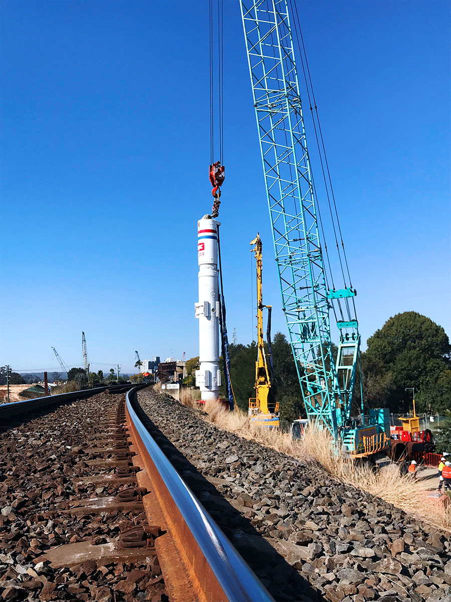 Train passenger view of piling occurring for the new Pound Street rail bridge (August 2018)