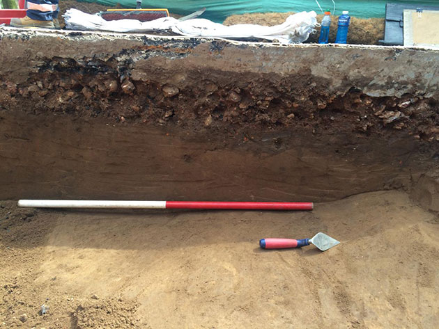 A typical historical test pit excavation, showing various soil layers
