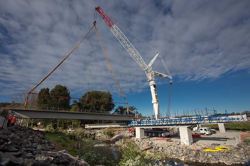 The 500 tonne crane placing the first bridge girders on Broughton Creek Bridge site number 1 (July 2