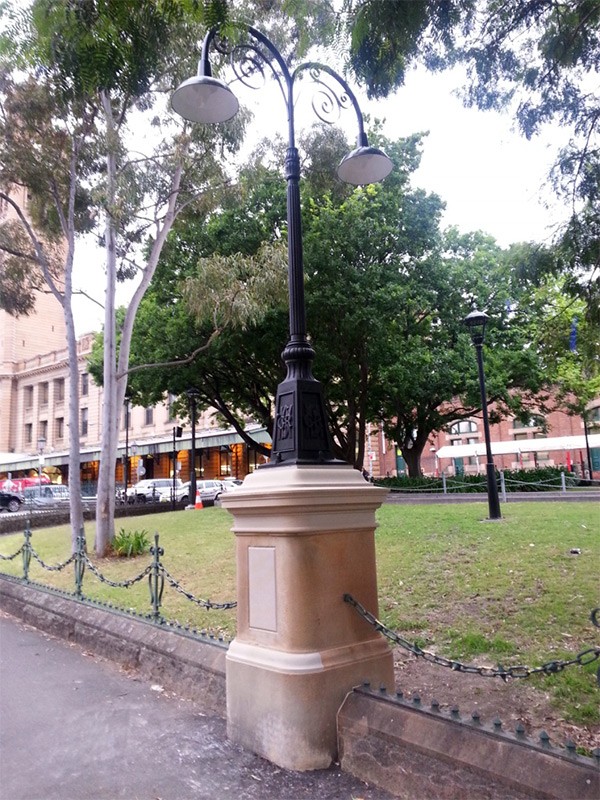 Central Station: Replica lamp installed on garden stone pillar.