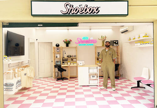 Man inside Shoebox pop-up store