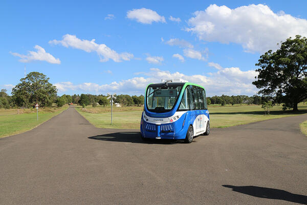 Smart shuttle driving through Sydney Olympic Park
