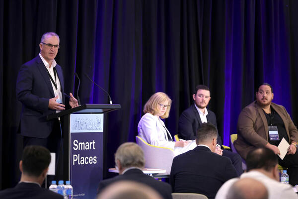 Smart Speed Session: Luke Nicholls, Director, Planning Partnership Office, Western Sydney Planning Partnership. In background: Sandy Burgoyne, Transport for NSW; Max Strassmeir, Wollondilly Shire Council; and Christopher Manoski, Cumberland City Council. 