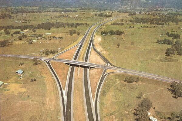Aerial view of the completed interchange with The Northern Road (then Bringelly Road) in 1971. Scanned from Main Road Journal.