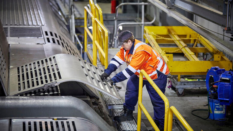 Transport for NSW Future Fleet program - engineer works on train.