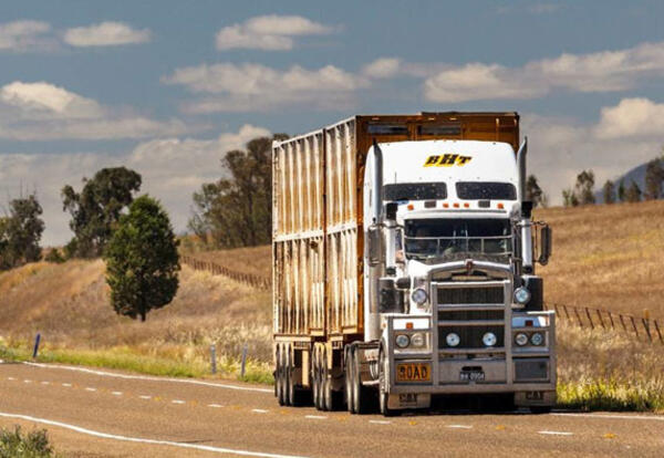 A truck driving down a road