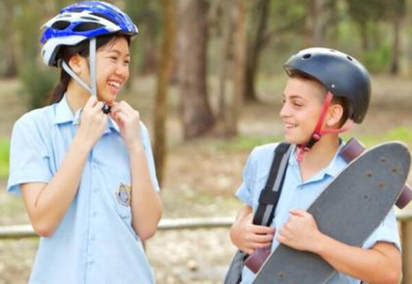 School children wearing helmets