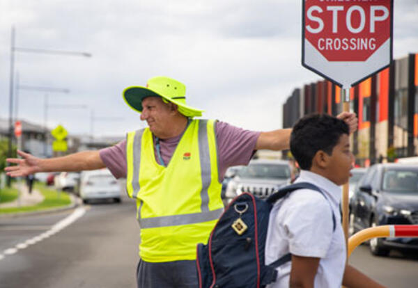 School Crossing Supervisor stopping traffic