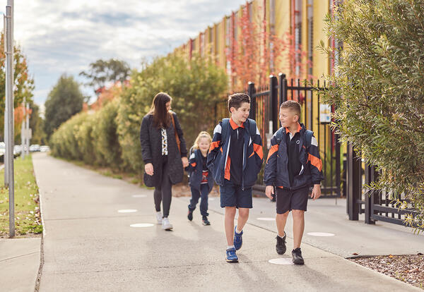  Transport for NSW Three children and one adult walking to school.