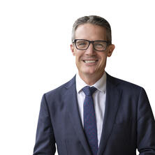 Matt Longland standing in front of a white background.